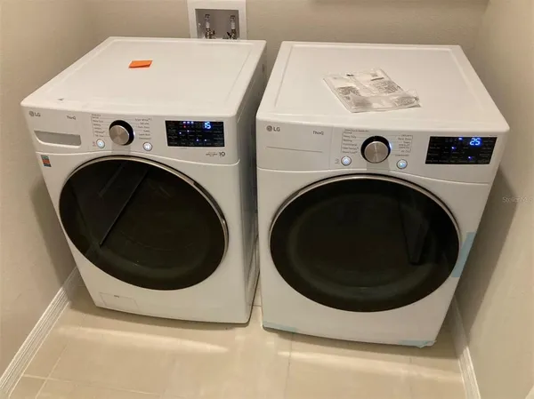 a utility room with dryer and washer