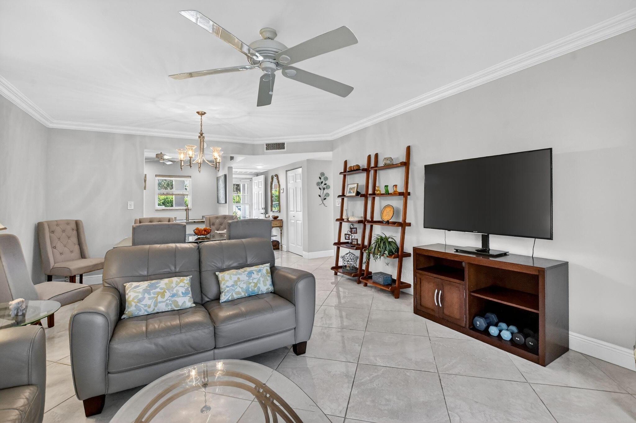 250 Northeast 20th Street, Unit 1170 Boca Raton, FL 33431 - Photo 15 of 40 a living room with furniture and a flat screen tv