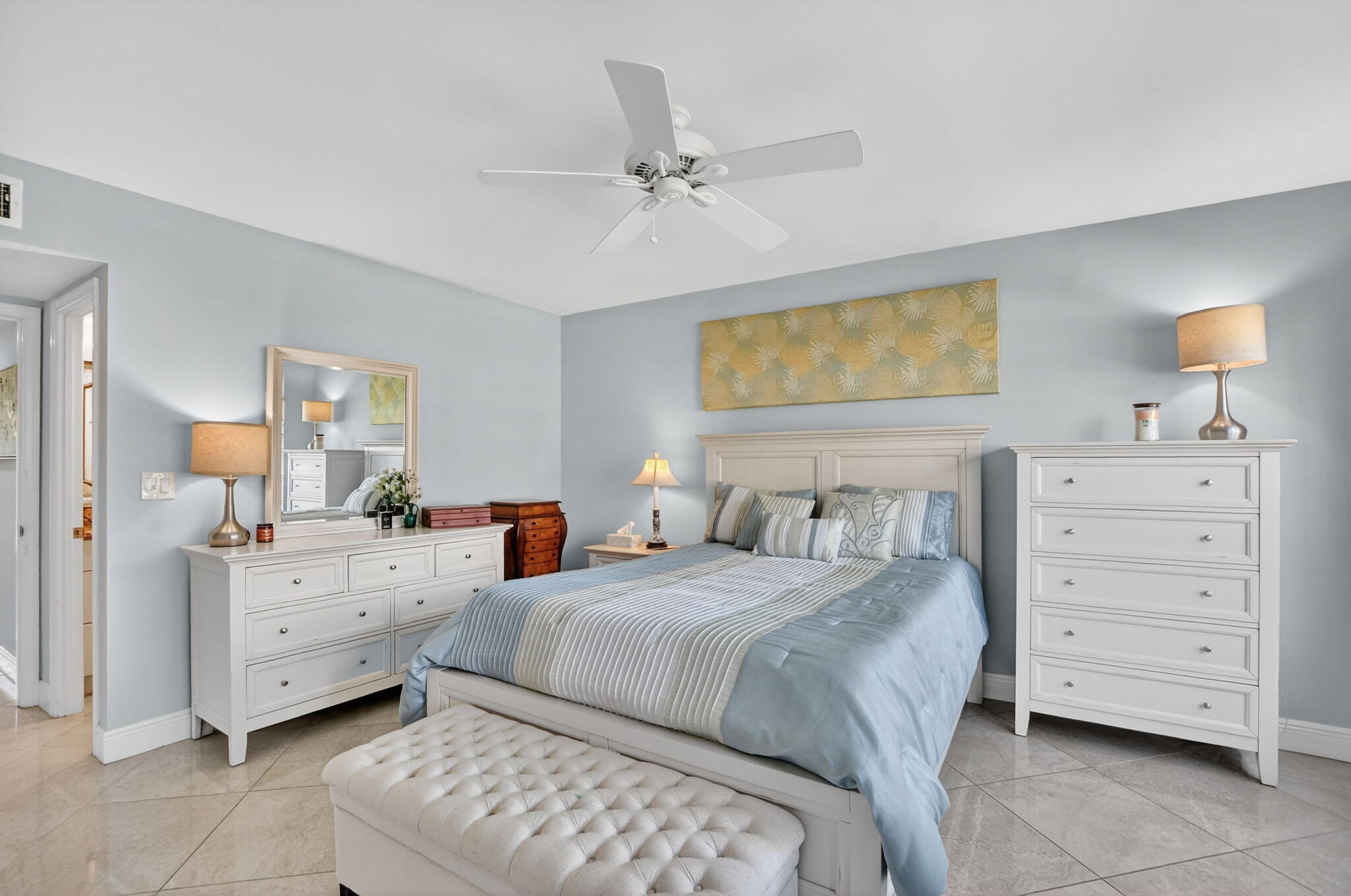 250 Northeast 20th Street, Unit 1170 Boca Raton, FL 33431 - Photo 18 of 40 a bedroom with a bed and a dresser