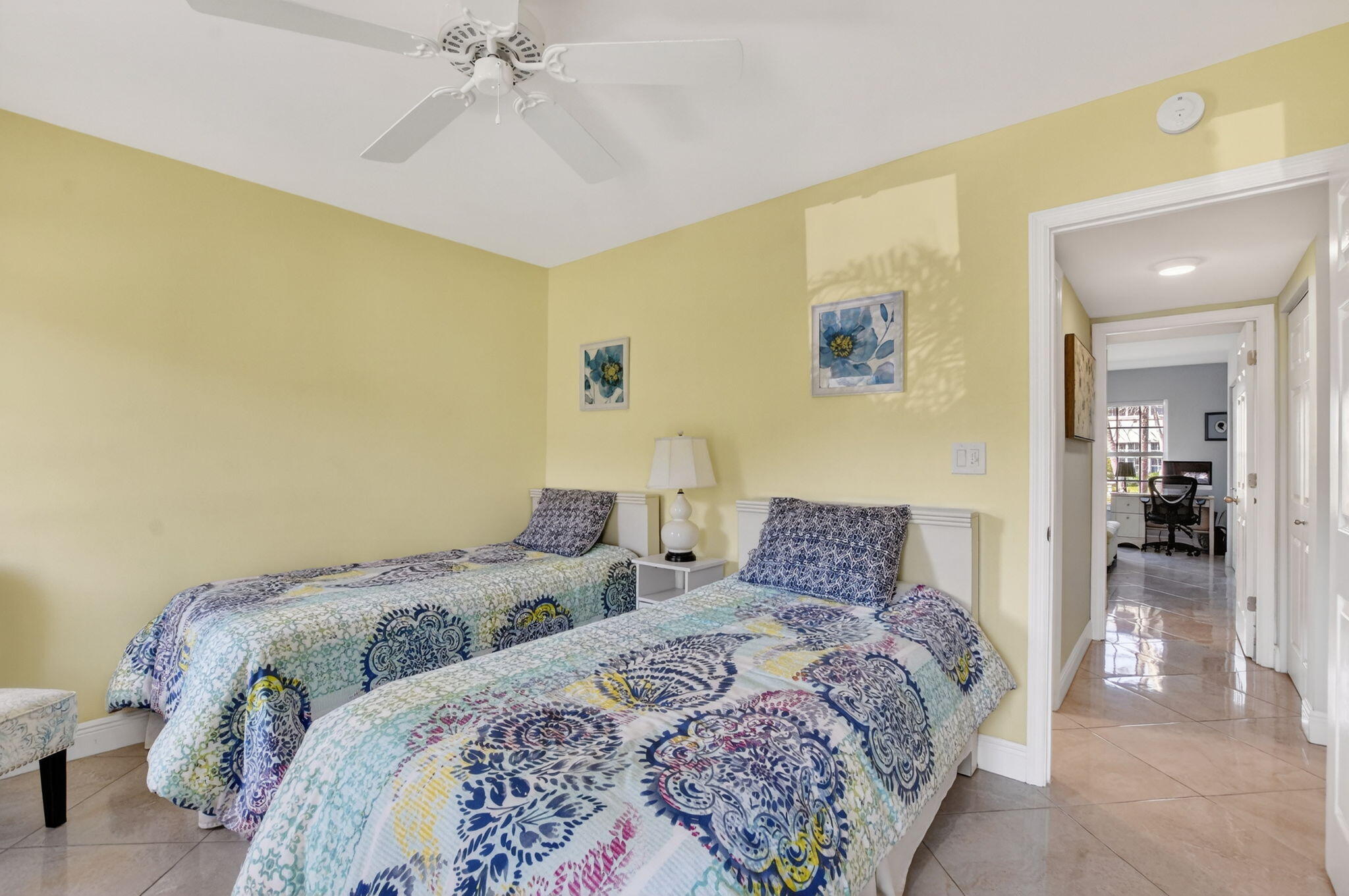 250 Northeast 20th Street, Unit 1170 Boca Raton, FL 33431 - Photo 22 of 40 a bedroom with a bed and a chandelier