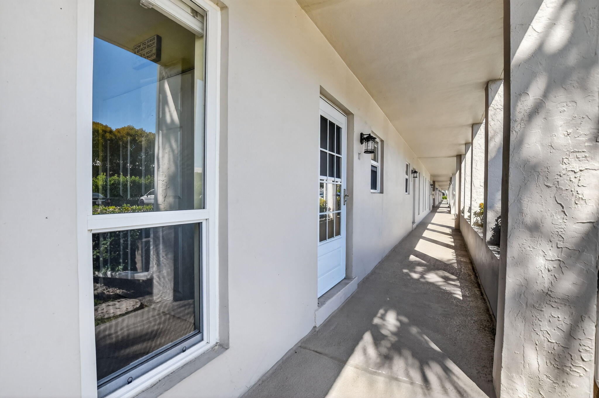 250 Northeast 20th Street, Unit 1170 Boca Raton, FL 33431 - Photo 3 of 40 a view of a hallway with windows