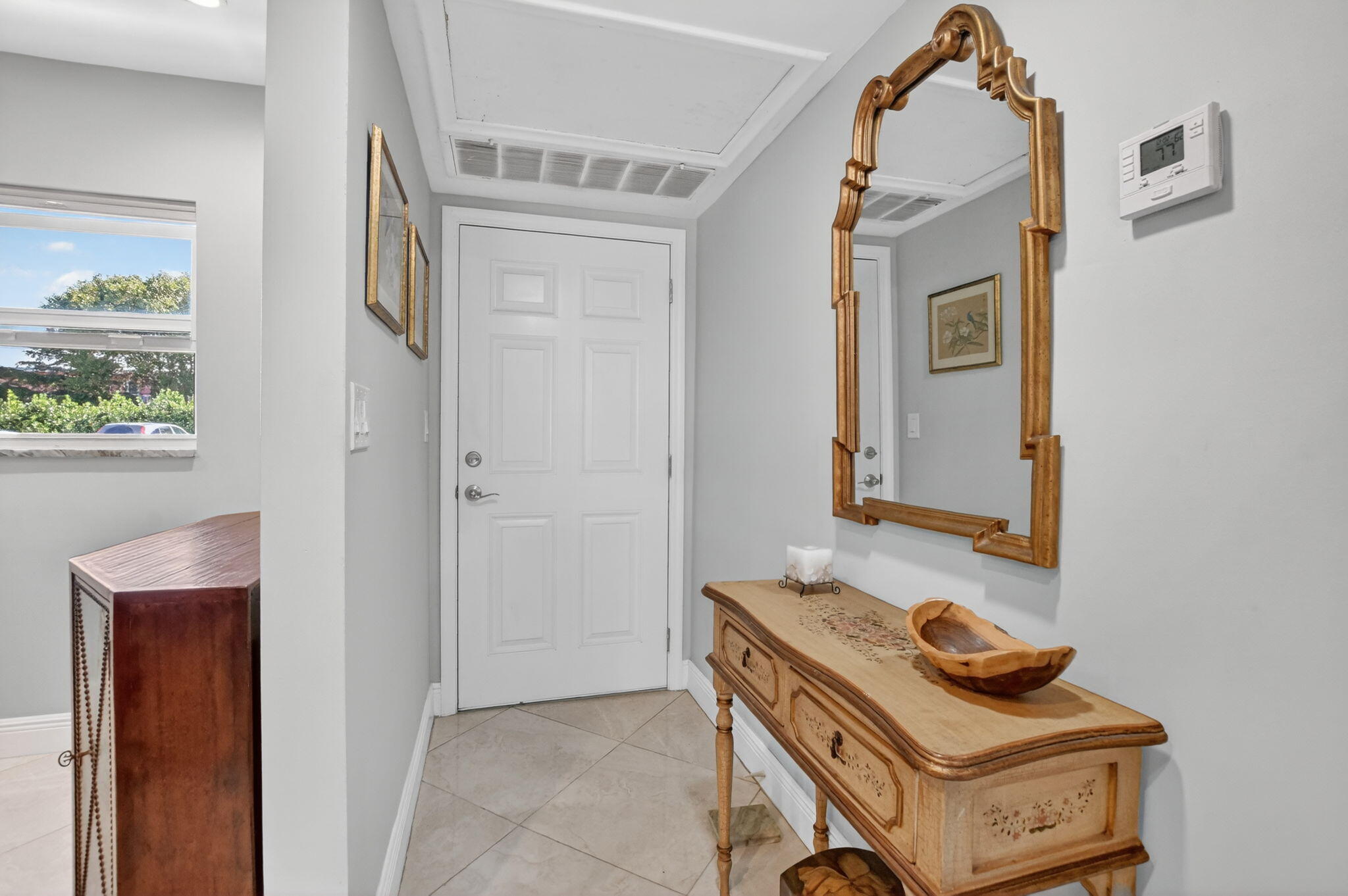 250 Northeast 20th Street, Unit 1170 Boca Raton, FL 33431 - Photo 5 of 40 a bathroom with a sink and a mirror