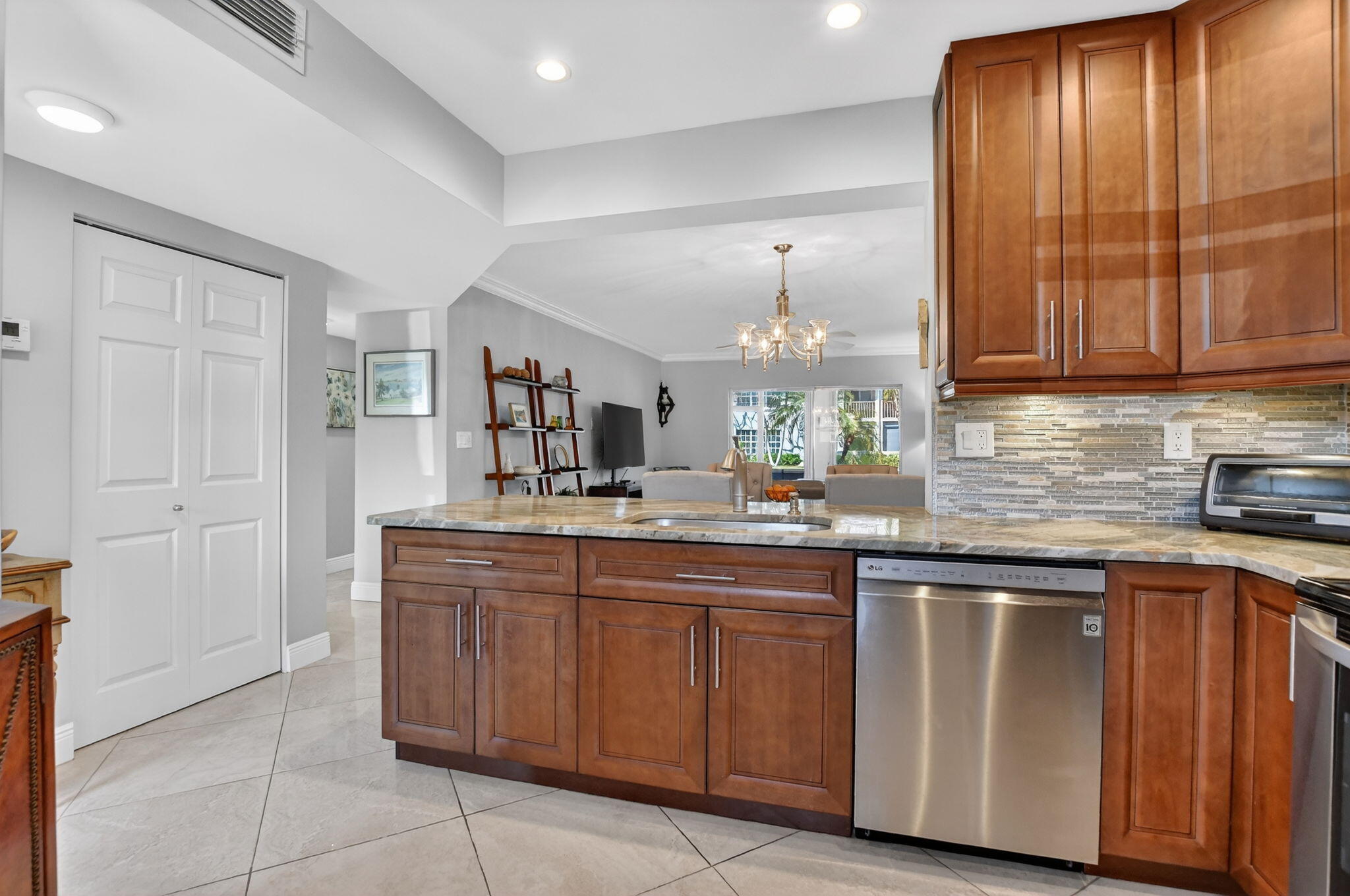 250 Northeast 20th Street, Unit 1170 Boca Raton, FL 33431 - Photo 9 of 40 a kitchen with a sink and cabinets