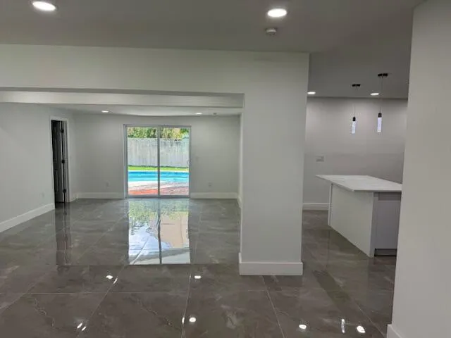 a view of a house with swimming pool and porch