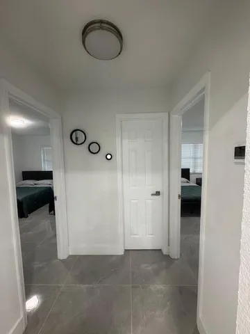 a bedroom with a bed and a view of bedroom