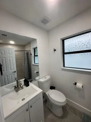 a view of utility room with racks on the wall