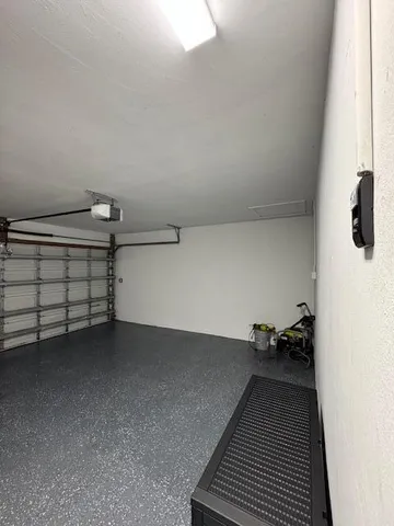 a living room with furniture a flat screen tv and a couch