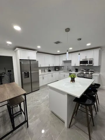 a bedroom with furniture and window