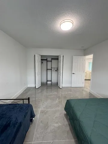 a room with furniture and view of living room