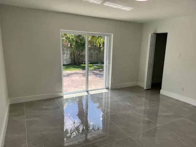 a view of a storage & utility room with a window