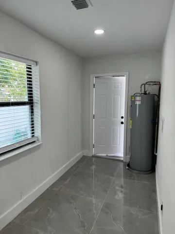 a view of an empty room and window