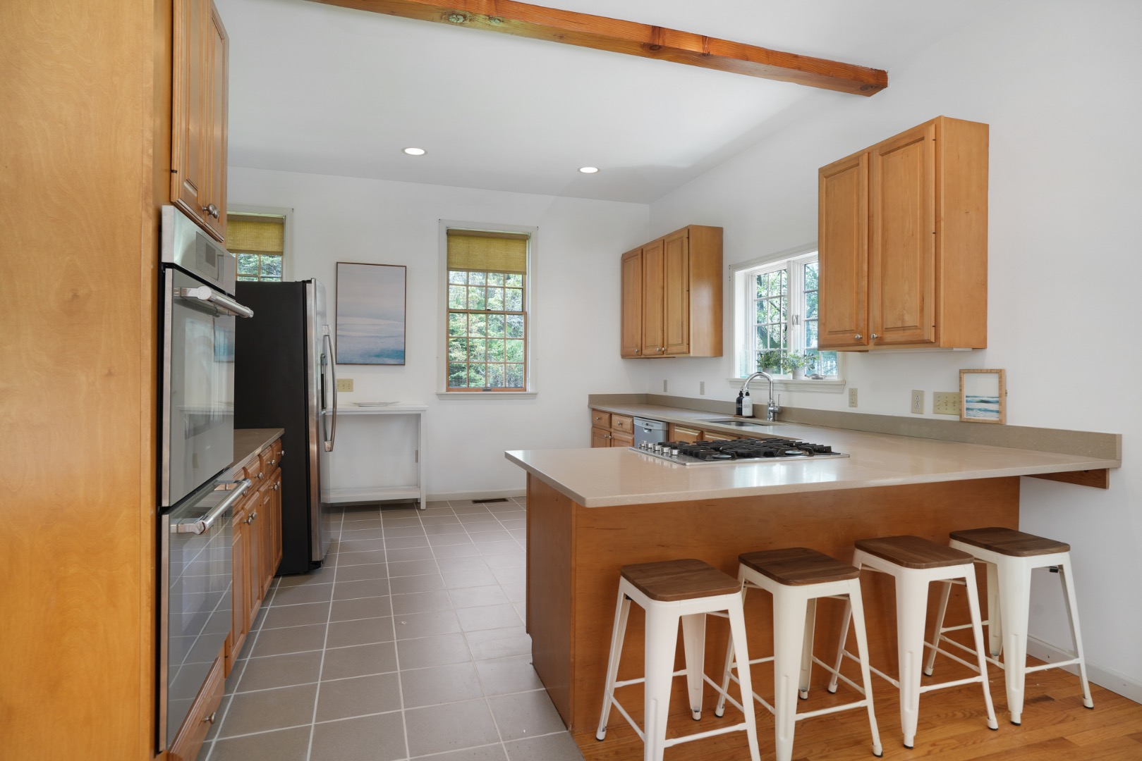 2 Cosmos Way Edgartown, MA 02539 - Photo 8 of 29 a kitchen with stainless steel appliances granite countertop a sink stove and refrigerator
