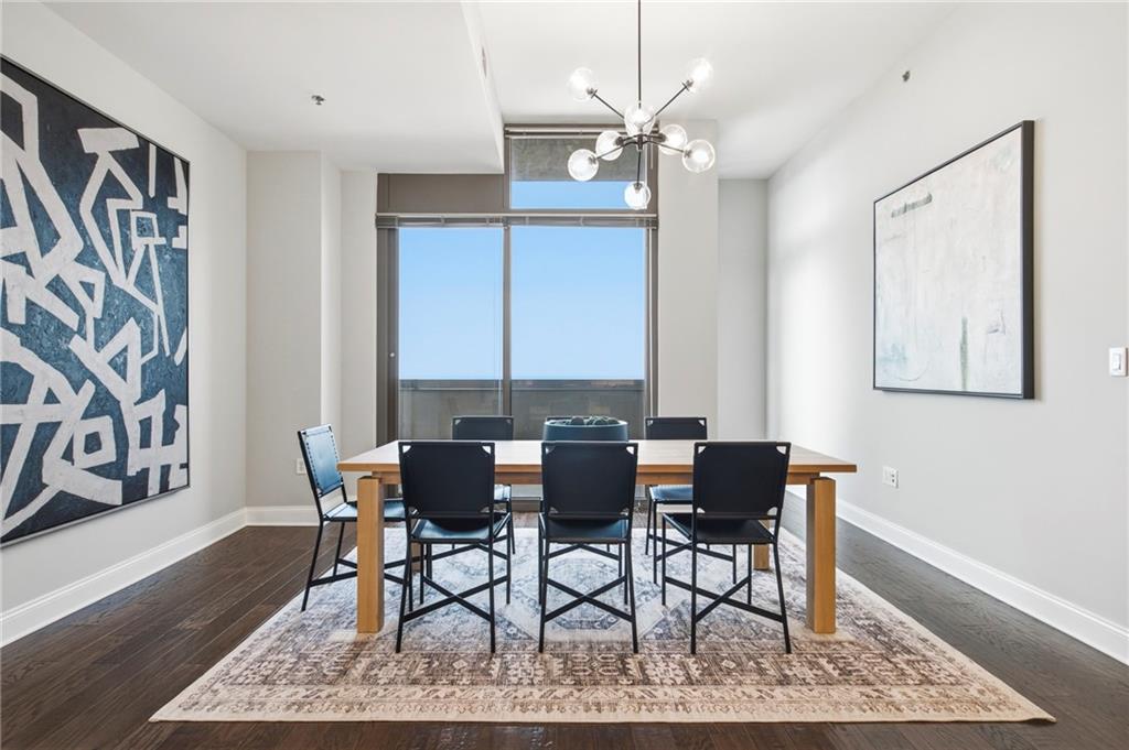 270 17th Street Northwest, Unit 4306 Atlanta, GA 30363 - Photo 13 of 37 a view of a dining room with furniture and wooden floor