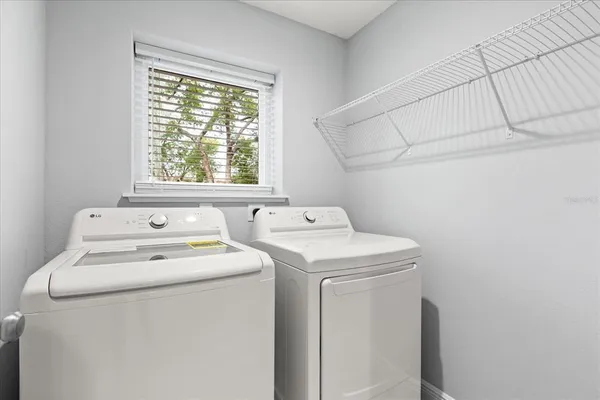 a utility room with dryer and washer