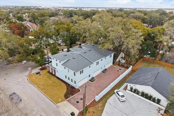 an aerial view of residential houses with outdoor space