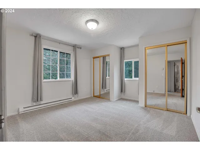 a view of empty room with windows