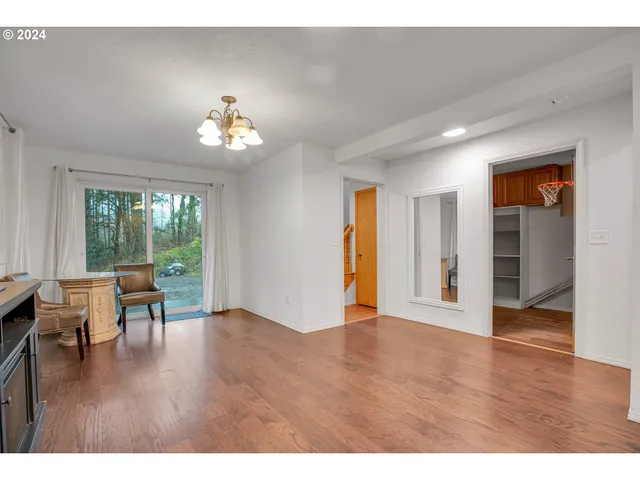 a view of living room with furniture and a flat screen tv