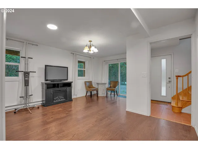 a view of a room with a table and chairs