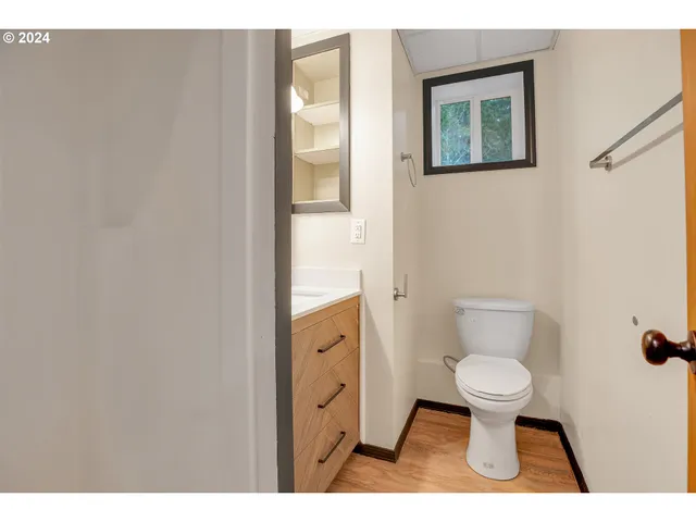 a kitchen with a refrigerator and sink