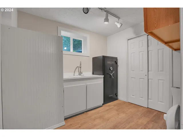 a view of an entryway with wooden floor