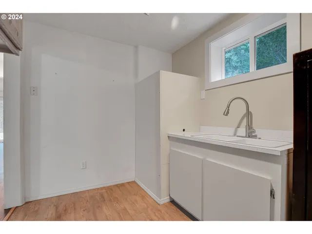 a view of a living room and a wooden floor