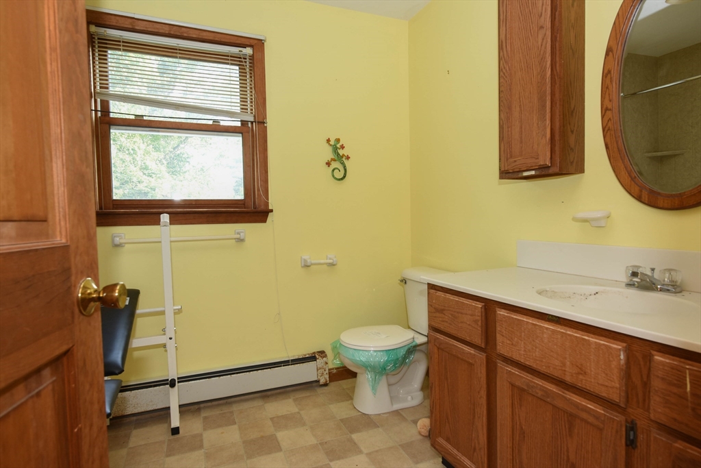 179 County Road Ashby, MA 01431 - Photo 24 of 33 a bathroom with a sink and a mirror