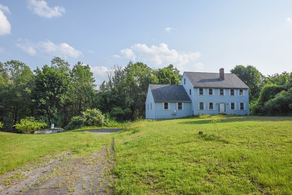 179 County Road Ashby, MA 01431 - Photo 4 of 33 a house view with a garden space
