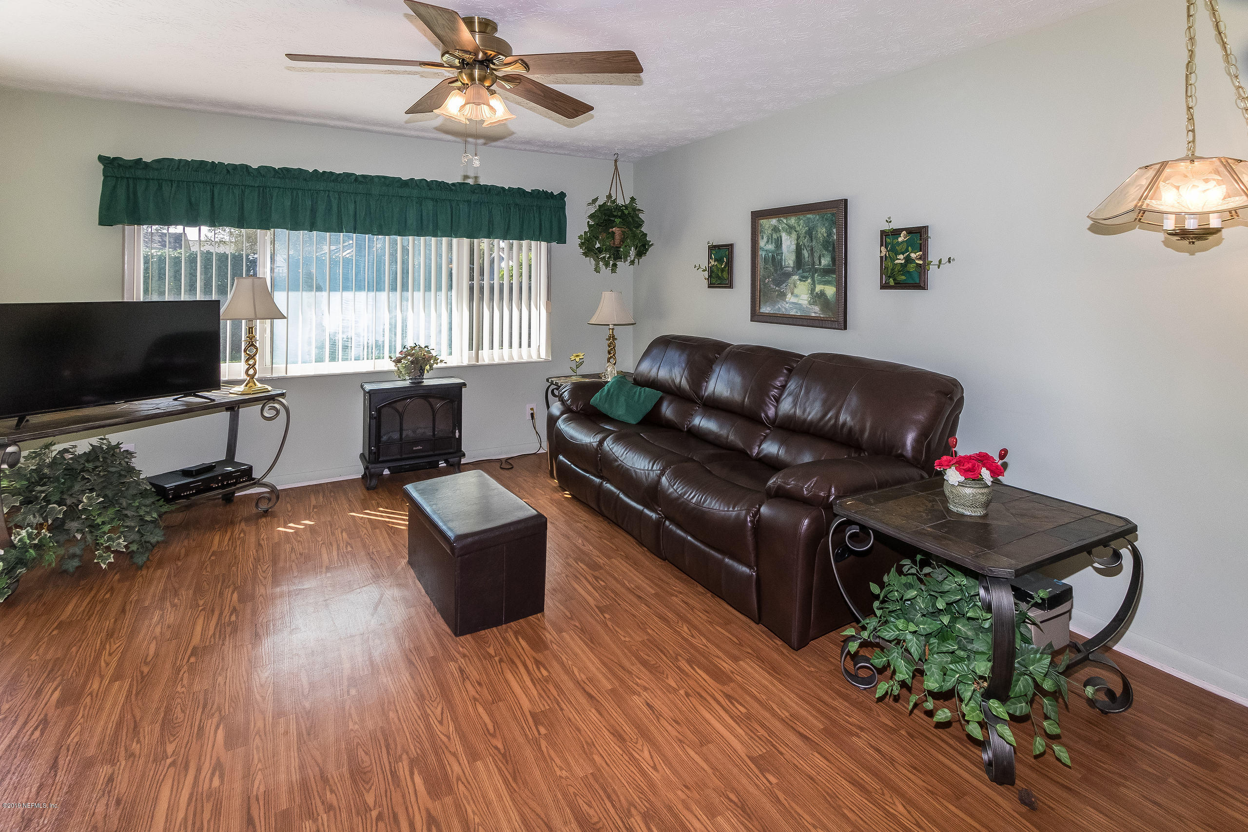 3 Amberjack Road Ponte Vedra Beach, FL 32082 - Photo 13 of 39 a living room with furniture and a flat screen tv