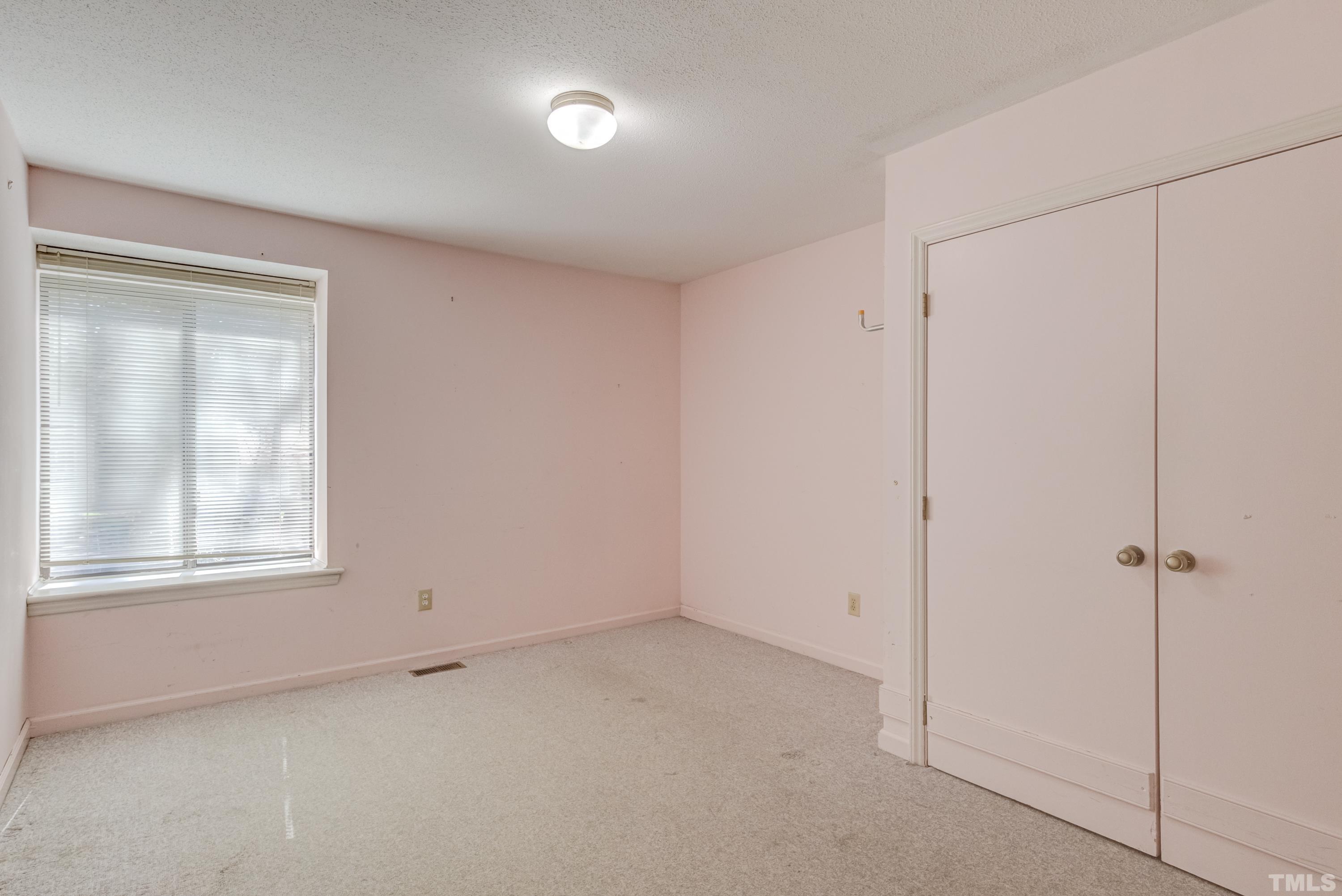 5869 Branchwood Road Raleigh, NC 27609 - Photo 15 of 35 a view of an empty room with a window