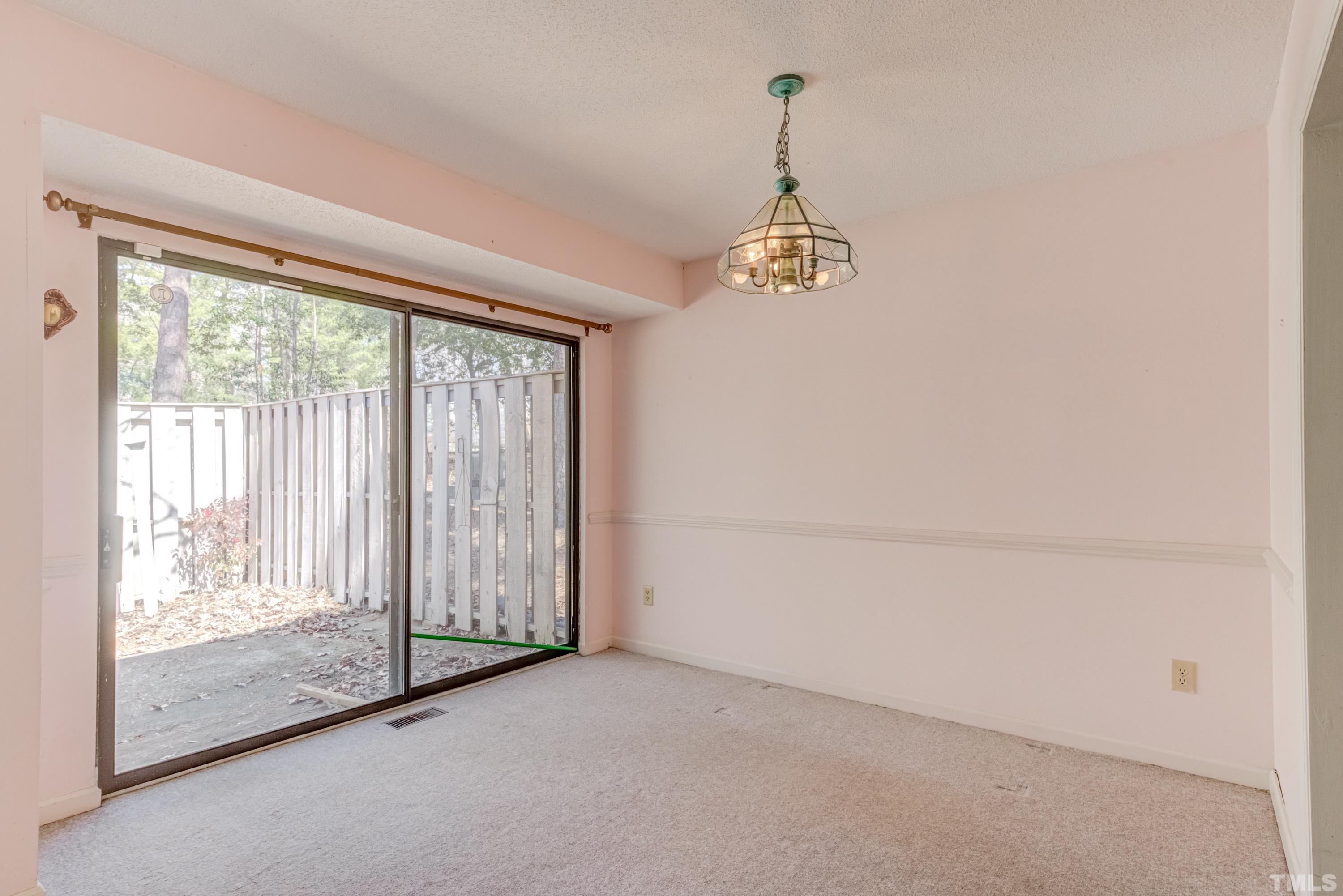5869 Branchwood Road Raleigh, NC 27609 - Photo 19 of 35 a view of empty room with floor to ceiling window