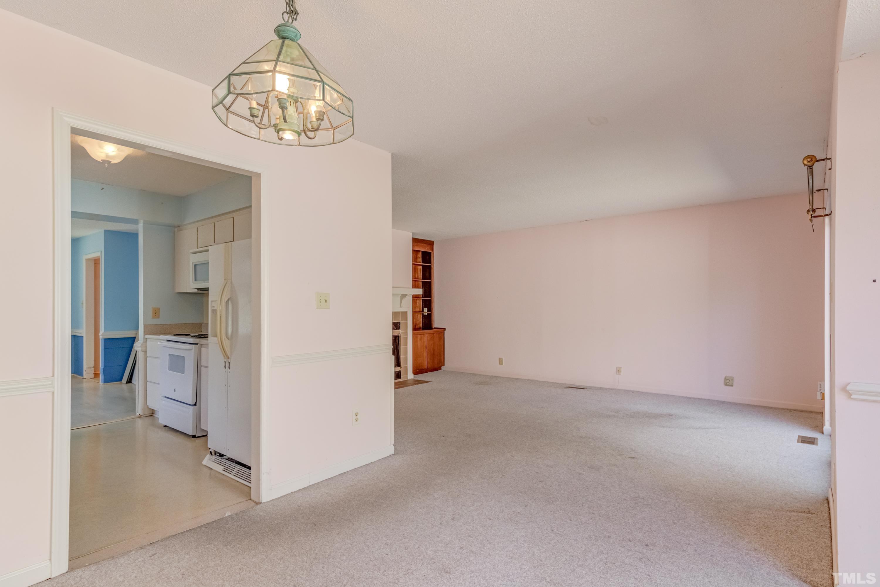 5869 Branchwood Road Raleigh, NC 27609 - Photo 20 of 35 wooden floor in an empty room and a bathroom