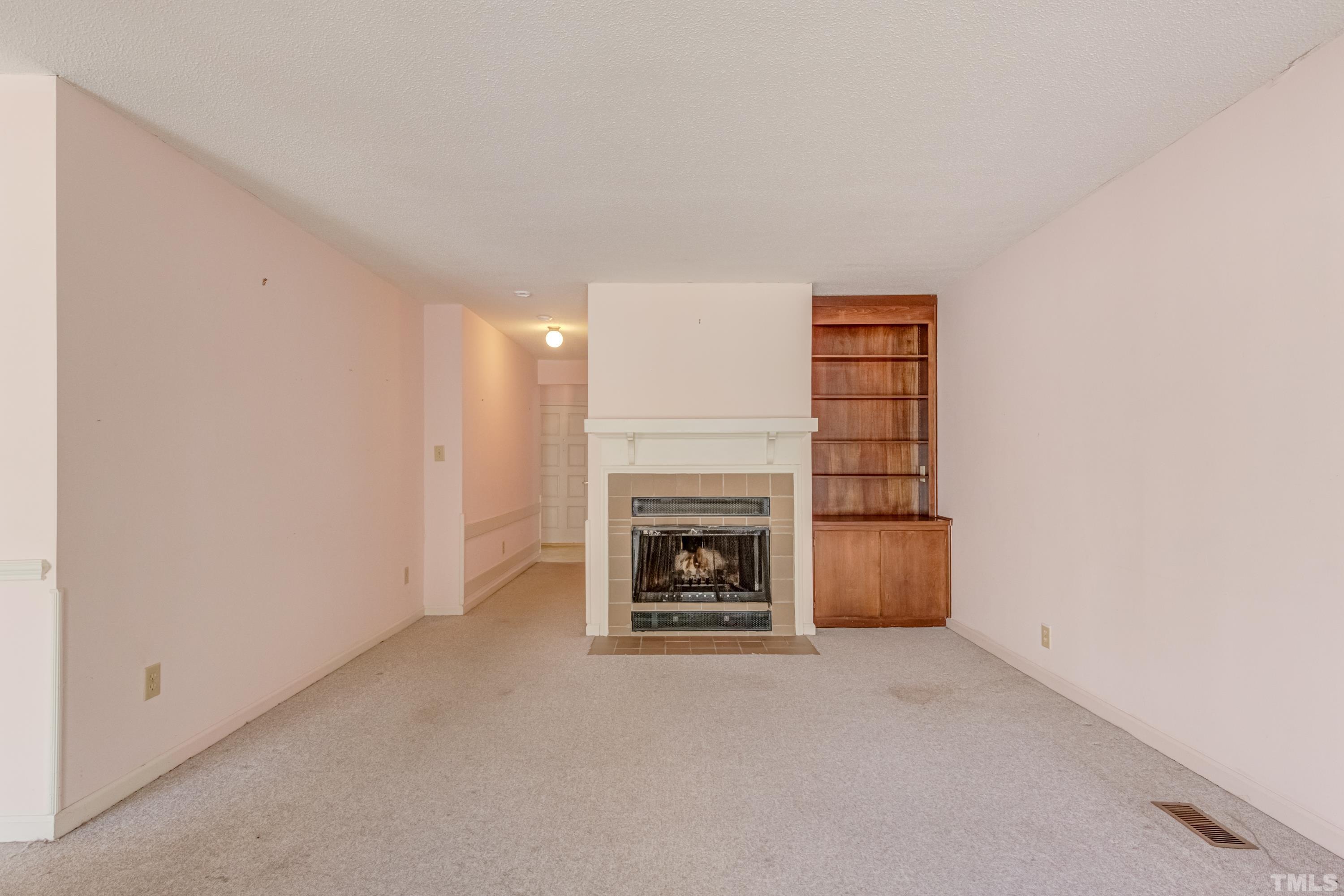 5869 Branchwood Road Raleigh, NC 27609 - Photo 30 of 35 a view of a livingroom with a fireplace