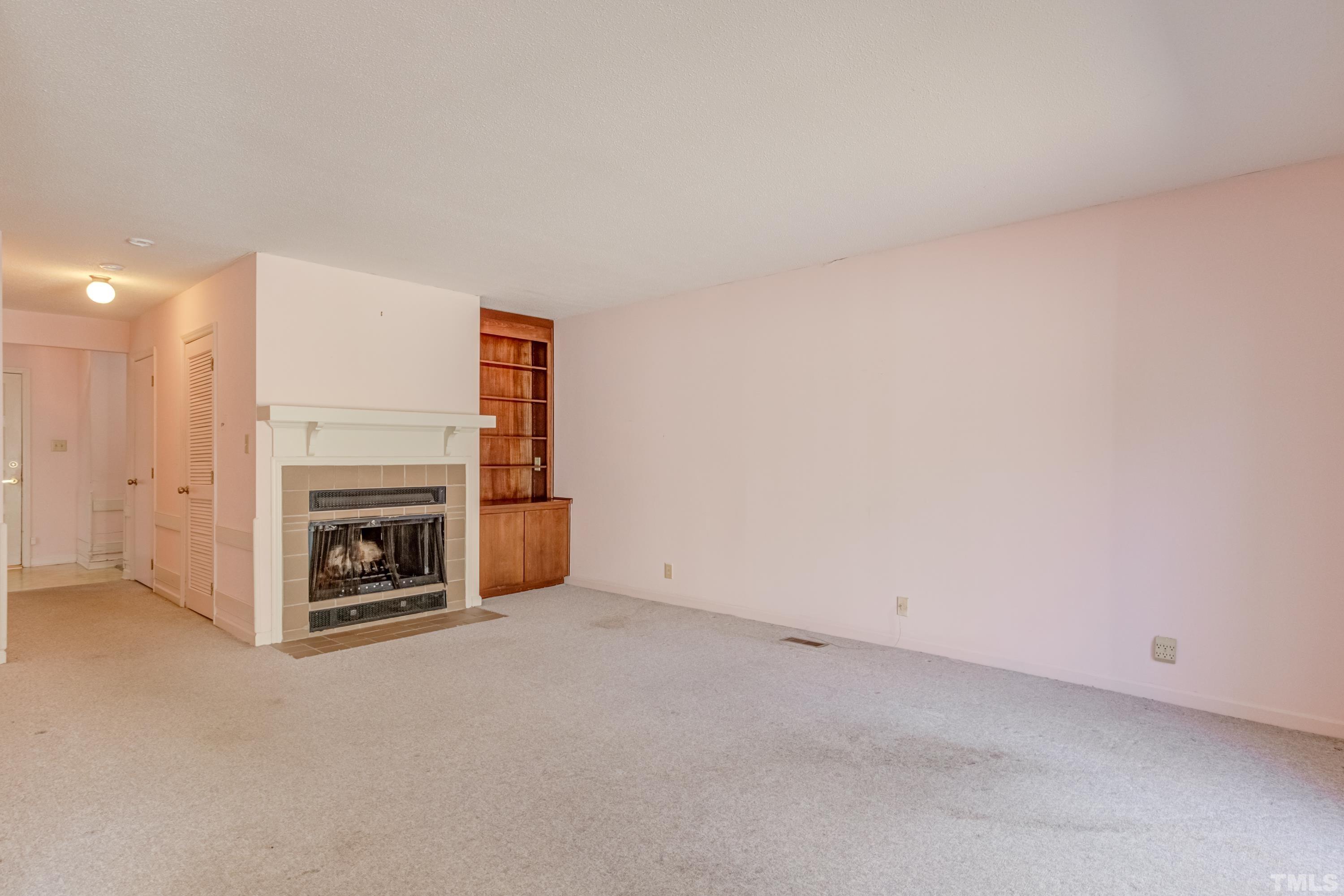 5869 Branchwood Road Raleigh, NC 27609 - Photo 32 of 35 a view of a livingroom with a fireplace