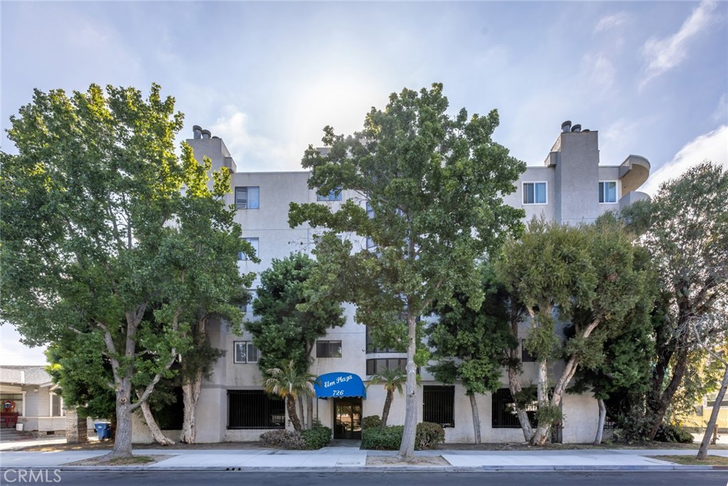 726 Elm Avenue, Unit 404 Long Beach, CA 90813 - Photo 2 of 31 a front view of a building with trees