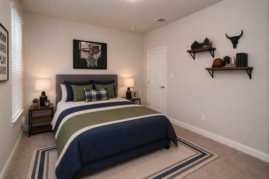 1804 Mensa Drive Haslet, TX 76052 - Photo 23 of 30 Carpeted bedroom featuring a large window with blinds, a white paneled door, and two wall-mounted shelves