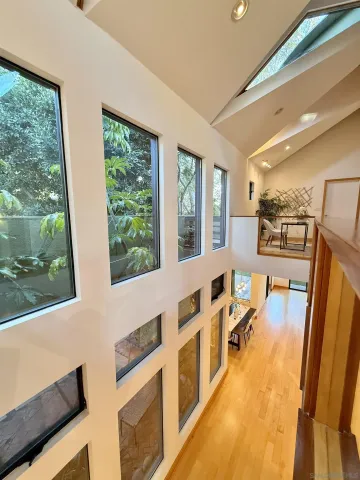 a workspace room with furniture and wooden floor