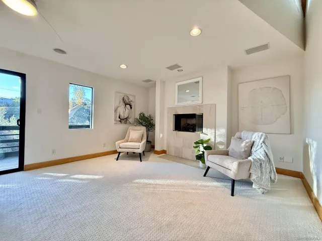 a white bath tub sitting in a bathroom next to a window