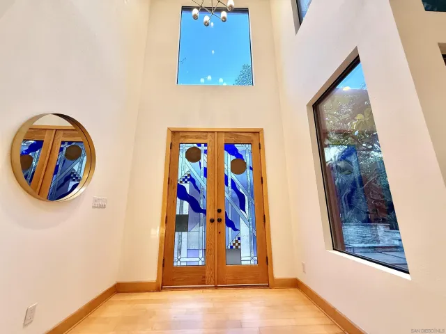 a view of an entryway with a floor to ceiling window and interior area