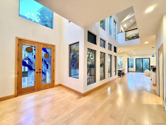 a large kitchen with a large counter top appliances and cabinets