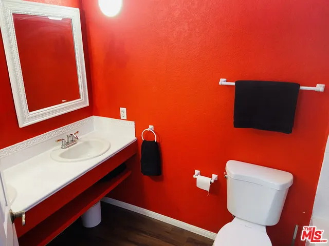 a kitchen with a sink appliances cabinets and furniture