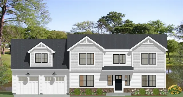 a view of a brick house next to a yard with large trees