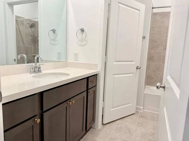 a kitchen with stainless steel appliances granite countertop cabinets wooden floor and a window