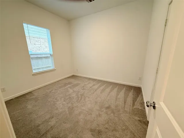 a bathroom with a bathtub and toilet