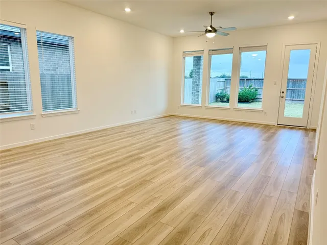 an empty room with a windows