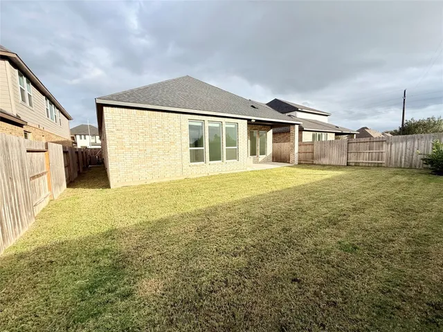 a view of room with window and wooden floor