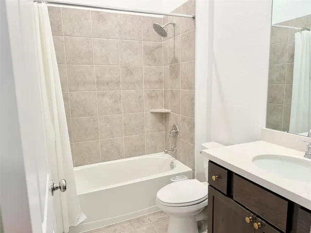 a bathroom with a sink a toilet and a bathtub