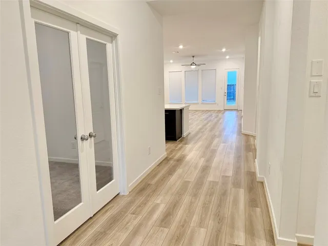 a view of a room with wooden floor and staircase