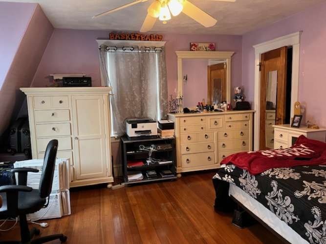 43 Loring Road Winthrop, MA 02152 - Photo 12 of 21 a bedroom with furniture and wooden floor