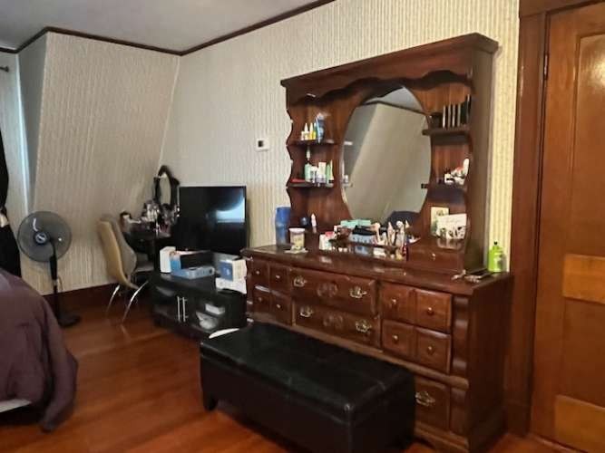 43 Loring Road Winthrop, MA 02152 - Photo 17 of 21 a living room with furniture and a mirror