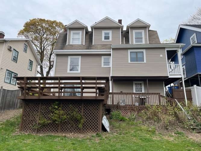 43 Loring Road Winthrop, MA 02152 - Photo 3 of 21 a front view of a house with a yard
